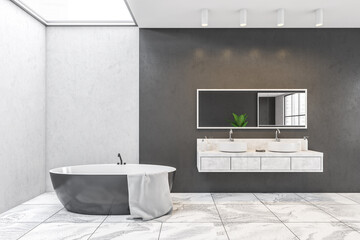 White and black walls in bathroom with bathtub and two sinks with mirror