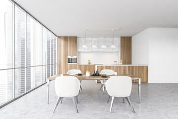 Wooden and white kitchen interior with table