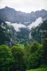 Fototapeta na wymiar cloudy valley in switzerland swiss alps