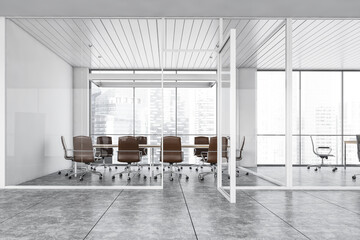 White and grey conference room with leather chairs and table near window