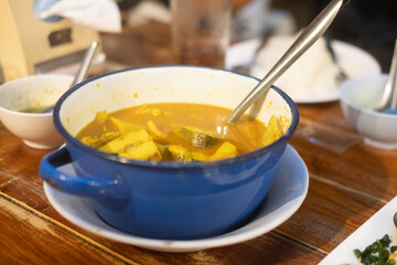 Yellow curry snapper fish with coconut shoots