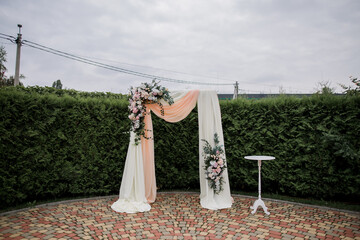 wedding arch for a ceremony with flowers
