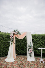 wedding arch for a ceremony with flowers
