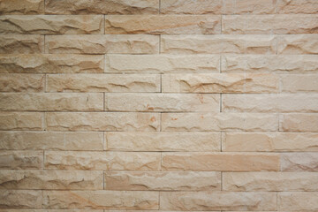 Wall lined with limestone slabs beige.
