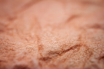 Extreme closeup of red handmade paper