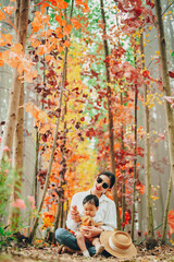 Fototapeta premium Mother and baby boy happy to living together around the garden.