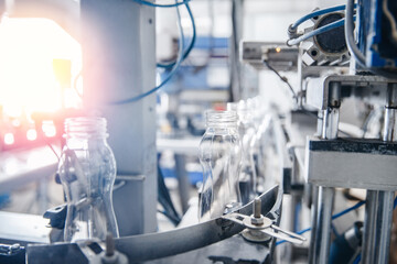 Dairy production, bottle of yoghurt on automated conveyor line, process of milk filling and packaging