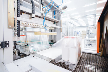 Dairy industry, thermal packer of milk bottles in plastic bags sets