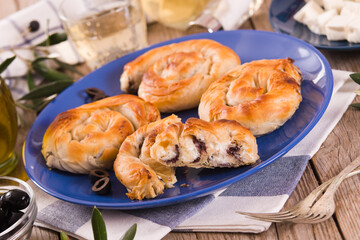 Pastry swirls with cheese and olive filling.
