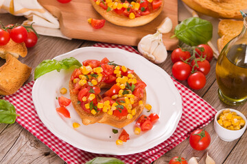 Friselle with tomatoes and mais.
