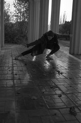 
Man dancing barefoot in the street