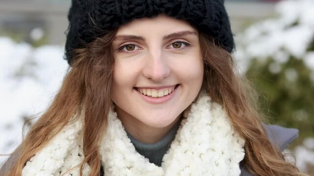 Close-up portrait of nice-looking curly caucasian beautiful person elegant young woman looking into camera. Career people. Fshion girl stand on winter street. Female portraits