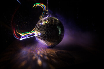 Colorful disco mirror ball lights night club background. Party lights disco ball. Selective focus