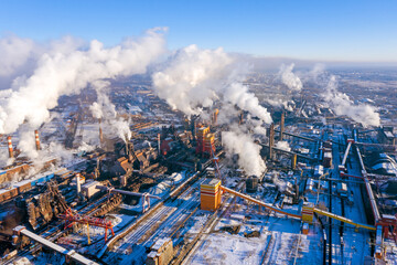 Flight over the metallurgical plant. Smoke and smog in the industrial zone. Environmental pollution concept