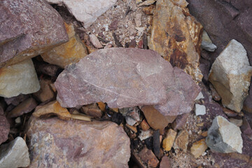 piece of Pink Arkose Sandstone rock on nature background. 
Sandstones are sedimentary rocks. 