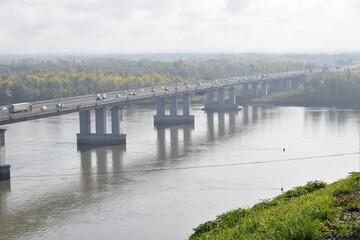 Fototapeta premium City bridge over the river in the fog