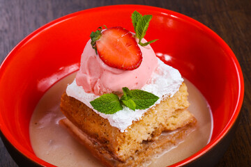 Cake with ice cream served stravberry