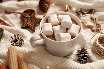 Cup of hot chocolate with marshmallow and christmas decorations. Winter cozy home concept