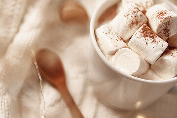 Cup of hot chocolate with marshmallow and christmas decorations. Winter cozy home concept
