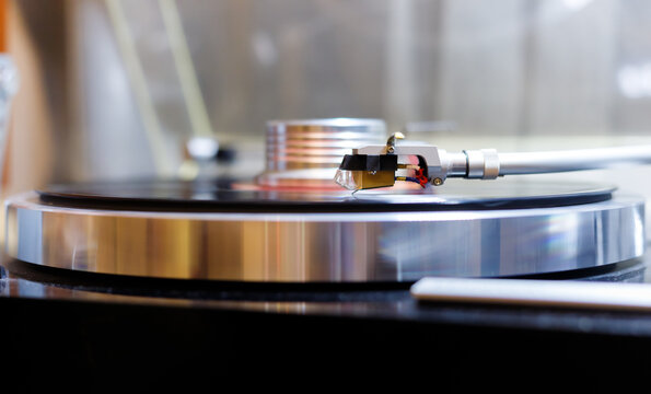 vinyl player playing record, headshell close up