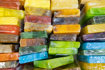 multicolored soap wrapped in cellophane lies together