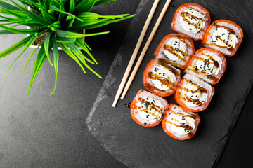 Sushi rolls Philadelphia with salmon and topped with cream cheese