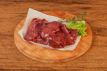 Raw chicken liver over board