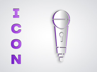 Paper cut Microphone icon isolated on grey background. On air radio mic microphone. Speaker sign. Paper art style. Vector.