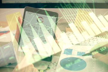 Multi exposure of man's hands holding and using a phone and financial chart drawing. Market analysis concept.