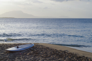 Surf board in the sand at the beach