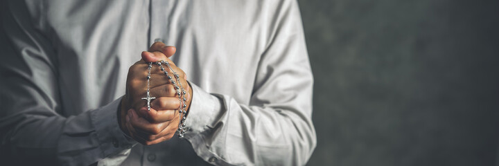 christianity background of man hand holding rosary praying for god blessing - obrazy, fototapety, plakaty