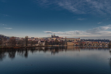 Prague from island on river Vltava near old bridges and towers