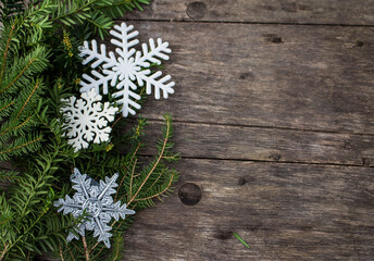 christmas decoration on wooden ground with fir und yew outside