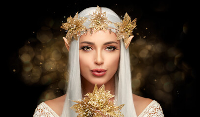 Attractive Elf Queen with Golden Christmas Poinsettia Flower in Glitters. Fairy Concept for Xmas - obrazy, fototapety, plakaty