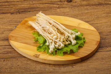 Raw Enoki mushrooms for cooking
