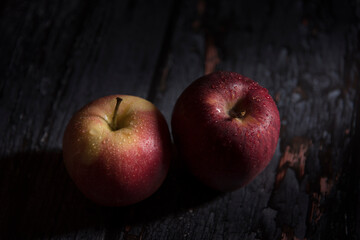 red apples on dark wooden background