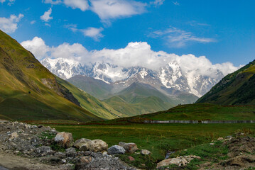 Fototapeta na wymiar valley with cloud covered mountain tops