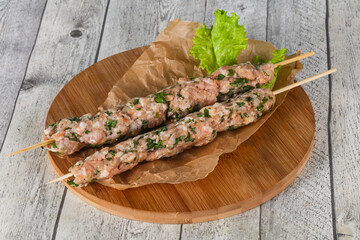 Raw minced pork skewer kebab for grill