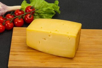 Hard yellow tasty cheese brick