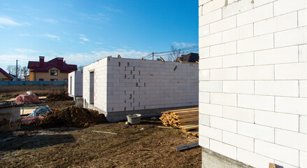 house under construction with autoclaved aerated concrete block structure at building site