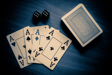 A deck of playing cards and two dice are on the Table.