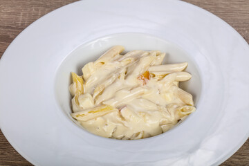 Italian pasta penne with cheese
