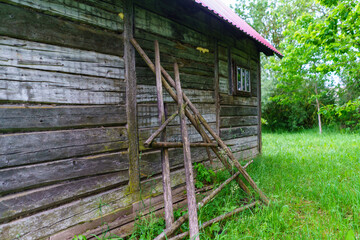 old building interior with wooden planks and brick wall