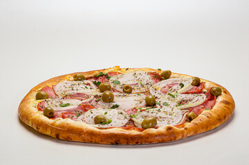 Traditional Brazilian pizza with Portuguese flavor, with mozzarella, eggs, onion, ham and olives on white background