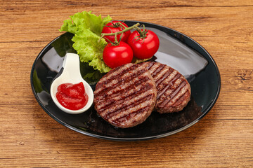 Grilled burger cutlet with sauce