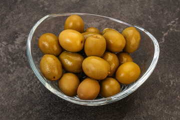 Green pickled olives in the bowl