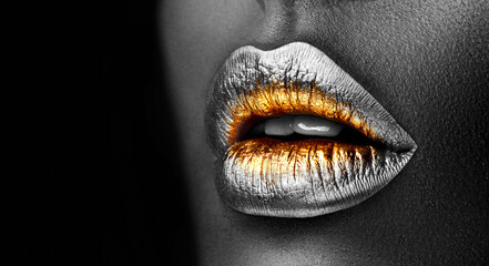 Golden lipstick closeup. Silver with Gold metal lips. Beautiful makeup. Sexy lips