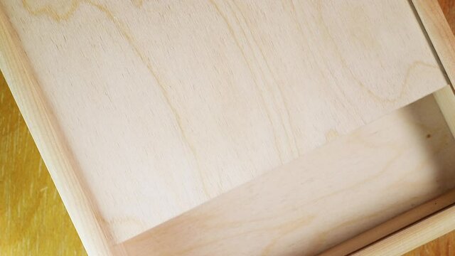 Closing empty brown wooden box