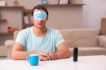 Young man sitting at home during pandemic