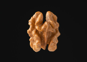 Walnut on a black background.